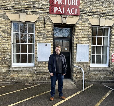 Ed Nutting outside Royston Town Hall, underneath the old Picture Palace sign above the entrance.