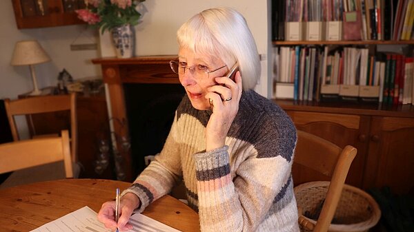 image of a woman on the phone